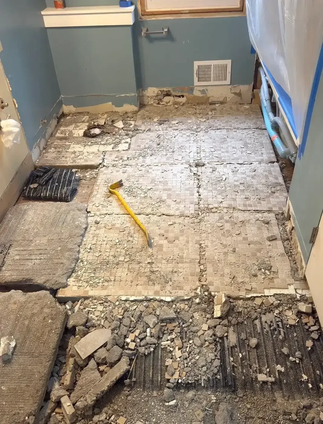 Mud-set bathroom floor removal by Demohaulic in Bloomfield Hills, Michigan
