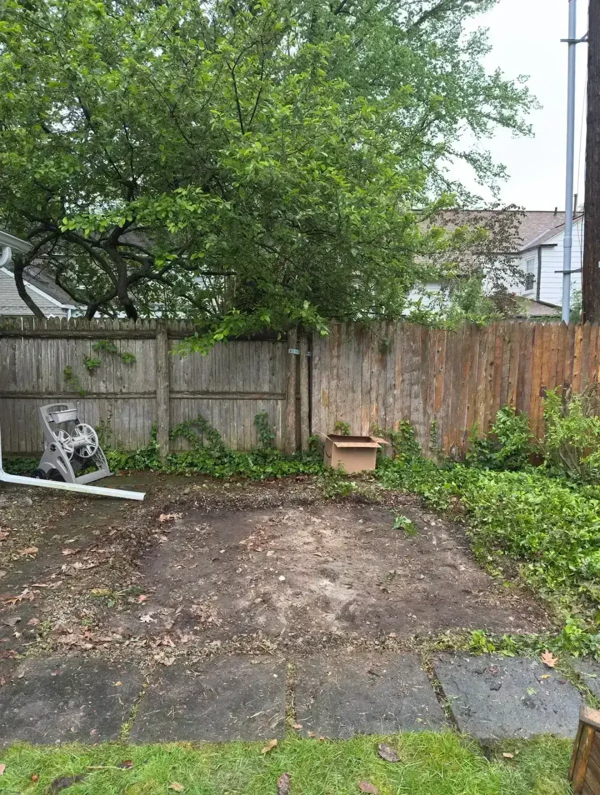 Cleared backyard area after shed removal in Grosse Pointe Farms, Michigan